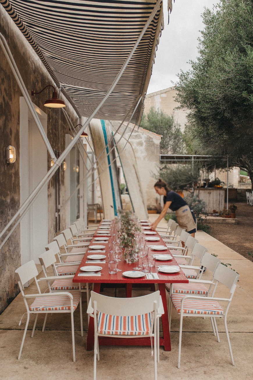 table being laid by a waitress